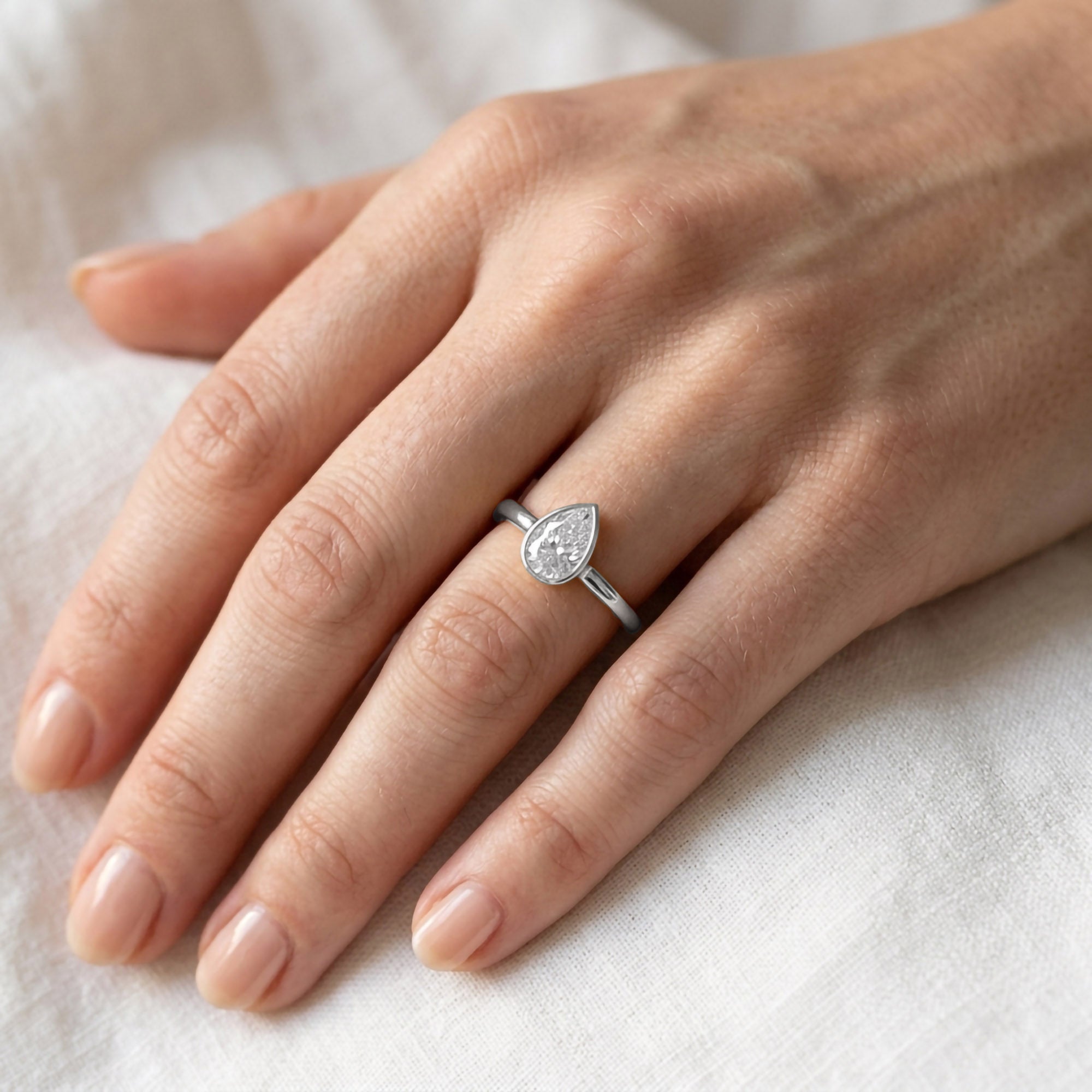 Zelie Pear Cut Bezel Set Lab Grown Diamond Engagement Ring